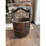 Wooden bucket with metal straps and wooden handle { 48cm H X 38cm Dia }.