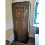 Art Deco carved oak gentleman's robe with a single long door { 183cm H X 74cm W X 44cm D }.