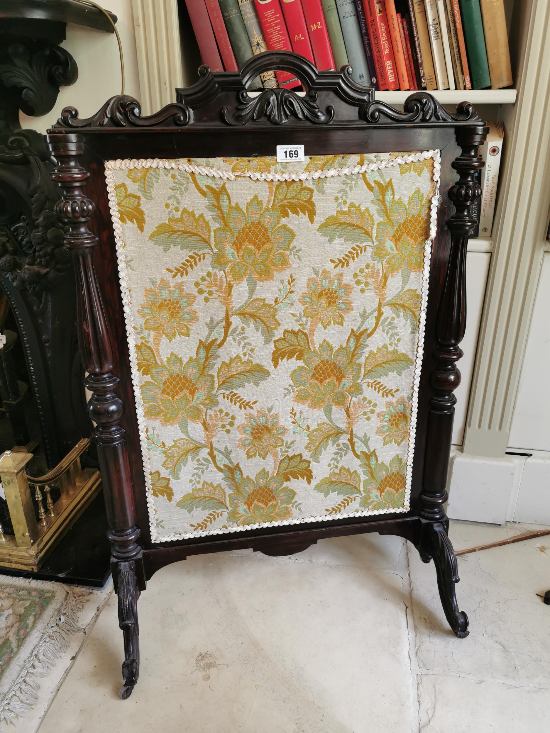 19th. C. mahogany fire screen the cloth panel flanked by turned columns raised on out swept supports