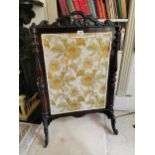 19th. C. mahogany fire screen the cloth panel flanked by turned columns raised on out swept supports