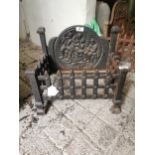 Cast iron dog grate { 37cm H X 42cm W X 26cm D }.