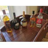 Collection of five bottles of spirits - Kilbeggan Traditional Irish Whiskey, Cork Dry Gin,