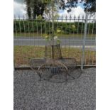 Wrought iron garden tree bench. {82 cm H x 133 cm W x 69 cm D}.