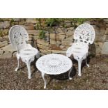 Cast aluminium garden coffee table with two fern leaf chairs. Table {35 cm H x 58 Dia} and