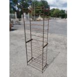 Wrought iron wine rack {156 cm H x 50 cm W x 23 cm D}.