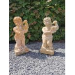 Pair of good quality terracotta cherubs holding baskets aloft. {65 cm H x 23 cm W x 18 cm D}.