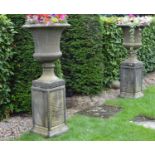 Pair of stone campana garden urns on matching plinths. { 136 cm H x 59 cm W}.