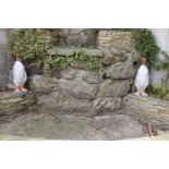 Pair of painted composition stone models of Penguins. {66 cm H x 29 cm W x 27 cm D}.