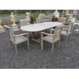 Good quality teak garden table with six matching chairs Table {76 cm H x 241 cm W x 100 cm D} and