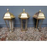 Set of three brass lanterns. {108 cm H x 62 cm W x 62 cm D}.