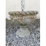 Pair of good quality composite stone urns decorated with acanthus leaves. { 50cm H X 53cm Dia}.