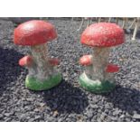 Set of two painted composition toad stools {33 cm H x 22 cm Dia.}.