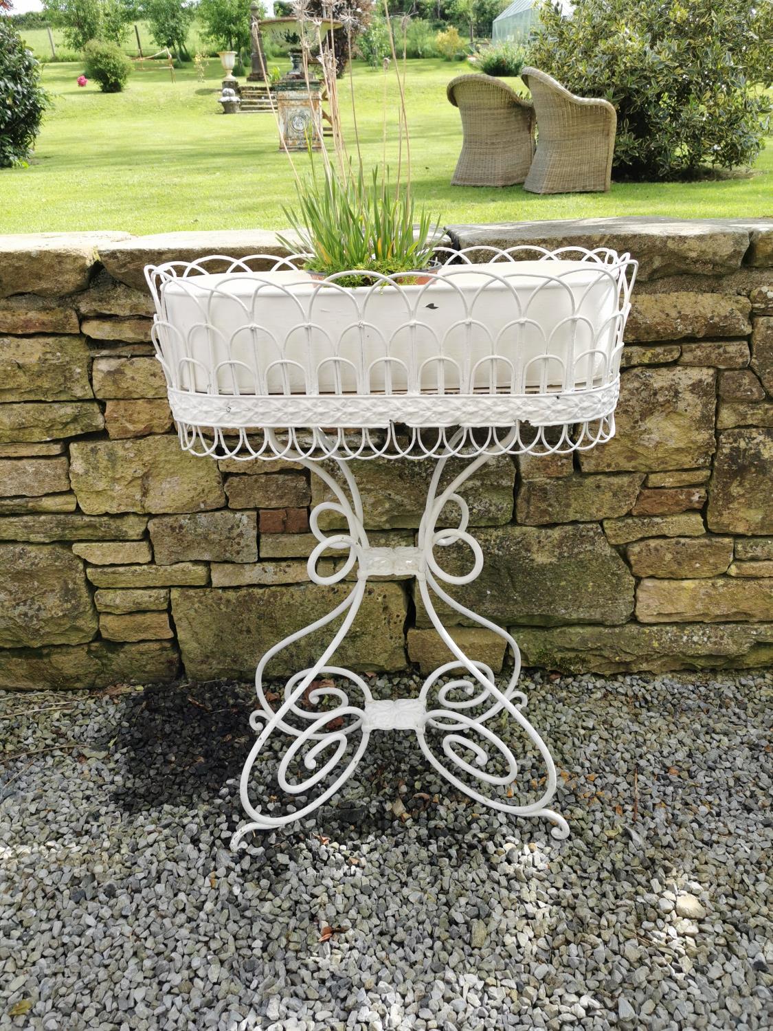 Metal plant stand with liner {95 cm H x 67 cm W x 30 cm D}.