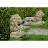 Pair of stone models of Recumbent Lions on rectangular platform. {55 cm H x 80 cm W x 31 cm D}.