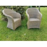 Pair of child's wicker garden arm chairs {70 cm H x 47 cm W x 50 cm D}.