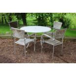 Garden table with aluminium top raised on wrought iron base with four chrome chairs. Table {72 cm