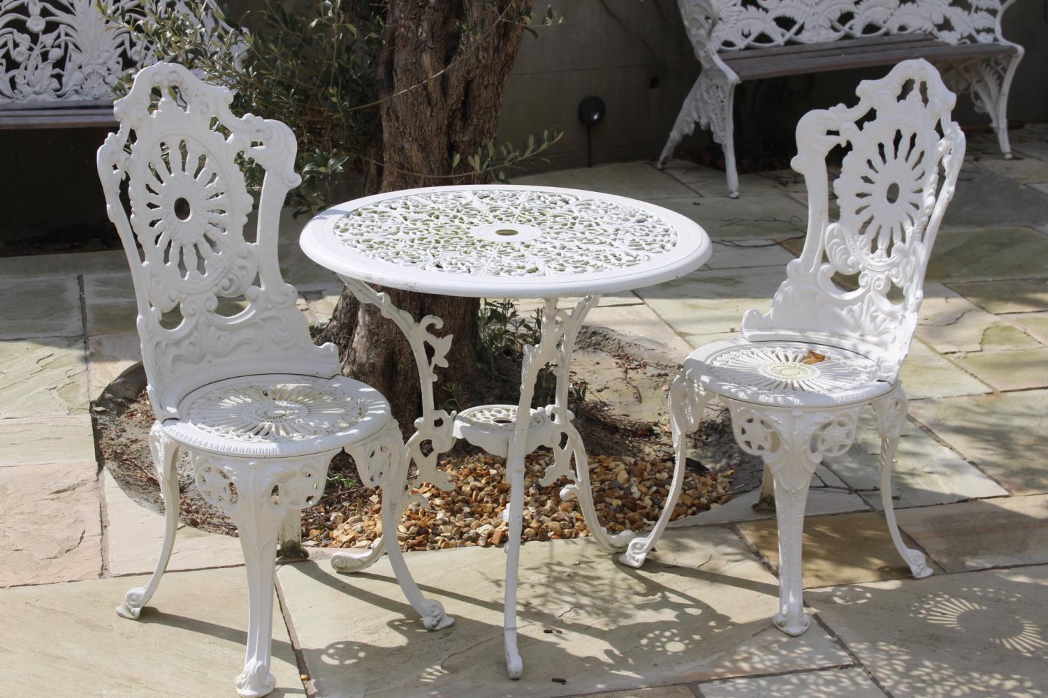 Cast aluminium garden table and two chairs. Table {89 cm H x 69 cm Dia.} and Chairs {94 cm H x 39 cm