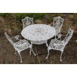 Cast aluminium garden table and four armchairs. Table {70 cm H x 102 Dia} and Chairs {90 cm H x 53