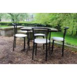 Wrought iron table with marble top and four metal and leather upholstered chairs . Table {74 cm H