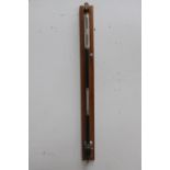 Early 20th. C. stick barometer mounted on oak plaque. {104 cm H x 9 cm W x 10 cm D}.