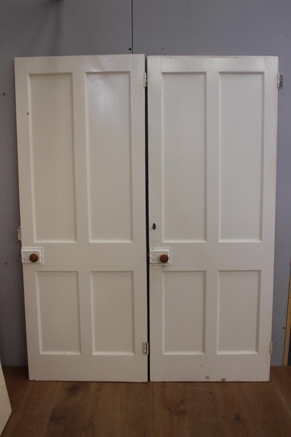 Two pairs of painted pine doors with fittings {198 cm H x 75 cm W x 44 cm D}