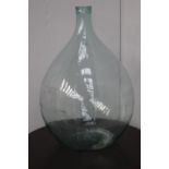 Clear glass wine bottle {66 cm H x 42 cm Dia.}.
