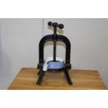 Cast iron wine press {46 cm H x 27 cm W x 24 cm D}.