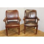 Pair of wooden and leather upholstered studded armchairs {87 cm H x 59 cm W x 47 cm D}.
