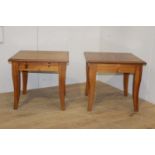 Pair of veneered coffee tables raised on tapered legs {56 cm H x 60 cm W x 60 cm D}.