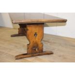 Oak refectory table raised on shaped supports with single stretcher {75 cm H x 198 cm W x 80 cm D}.