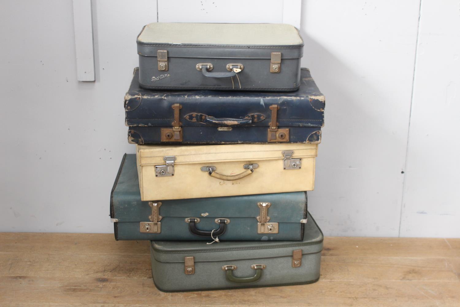 Collection of five suitcases.