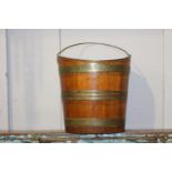 Teak and brass bound oyster coal bucket {34 cm H x 33 cm W x 26 cm D}.
