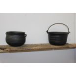 Cast iron pot and cast aluminium pot {13 cm H x 24 cm Dia. and 13 cm H x 18 cm Dia.}.