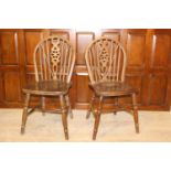 Pair of oak Windsor kitchen chairs {88 cm H x 40 cm W x 40 cm D}.
