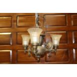 Polished metal three branch chandelier with clear glass shades {40 cm H x 50 cm Dia.}.