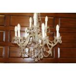 Nine branch crystal chandelier {110 cm H x 70 cm Dia.}.