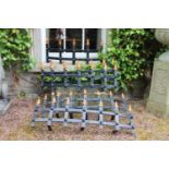 Four wrought iron window guards with spiked finials {43 cm H}.