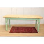 Pine kitchen table raised on painted turned legs {75 cm H x 194 cm W x 87 cm D}.