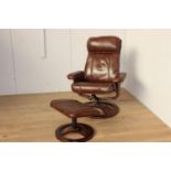 Leather swivel armchair with matching footstool {Chair 103 cm H x 82 cm W x 48 cm D and Stool 38