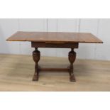 Oak extending dining table {77 cm H x 90 cm W/Extension 150 cm W x 84 cm D}.