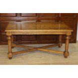 Oak coffee table raised on turned legs {59 cm H x 120 cm W x 67 cm D}.