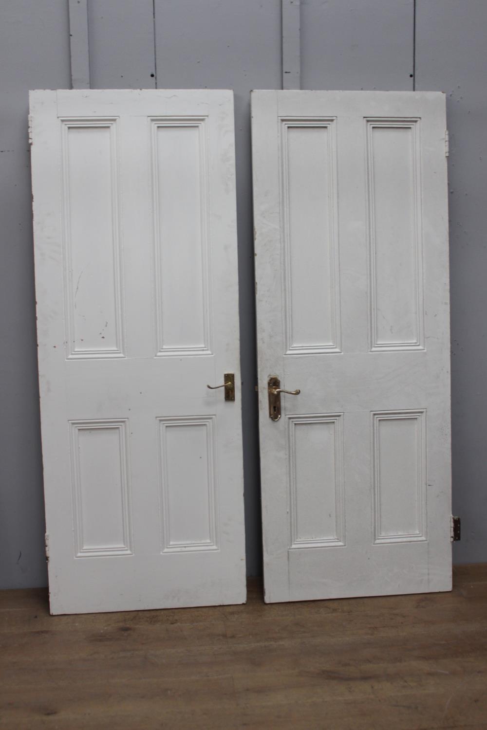 Set of two painted pine internal doors with brass handles {198 cm H x 76 cm W}