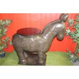 Stone model of a Donkey surmounted with glass planter base. { 110 cm H x 106 cm W x 49 cm D}.