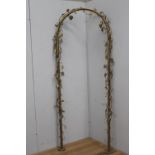 Brass wedding arch with lights decorated with grapes and flowers {220 cm H x 90 cm W x 10 cm D}.