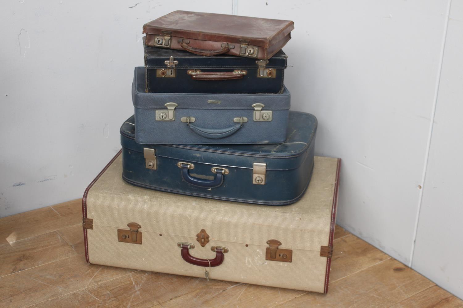 Collection of five suitcases.