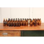 Collection of eighty Chemist bottles with stoppers {Larges 12 cm H x 5 cm Dia. and Smallest 7 cm H x