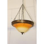 Brass hanging uplighters with amber shade {18 cm H x 39 cm Dia.}.