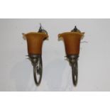 Pair of brass wall lights with amber tulip shades {35 cm H x 15 cm W x 29 cm D}.