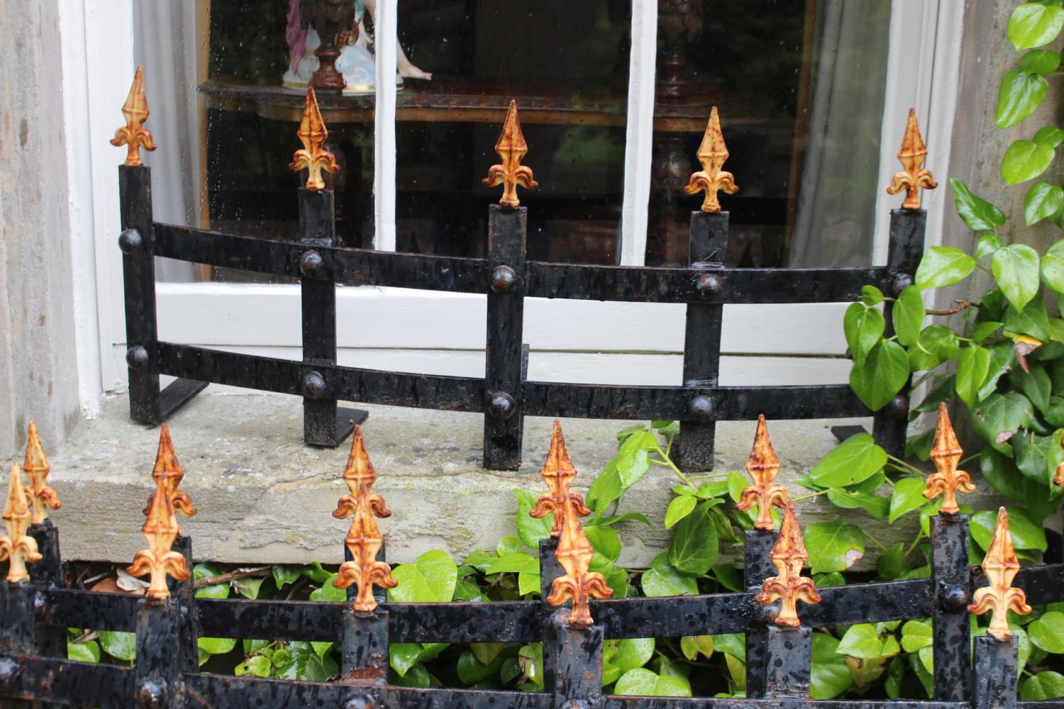 Four wrought iron window guards with spiked finials {43 cm H}. - Image 2 of 4