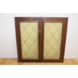 Pair of leaded stain glass windows {95 cm H x 48 cm W x 2 cm D}.